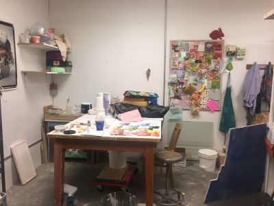 art studio space with various supplies laid out